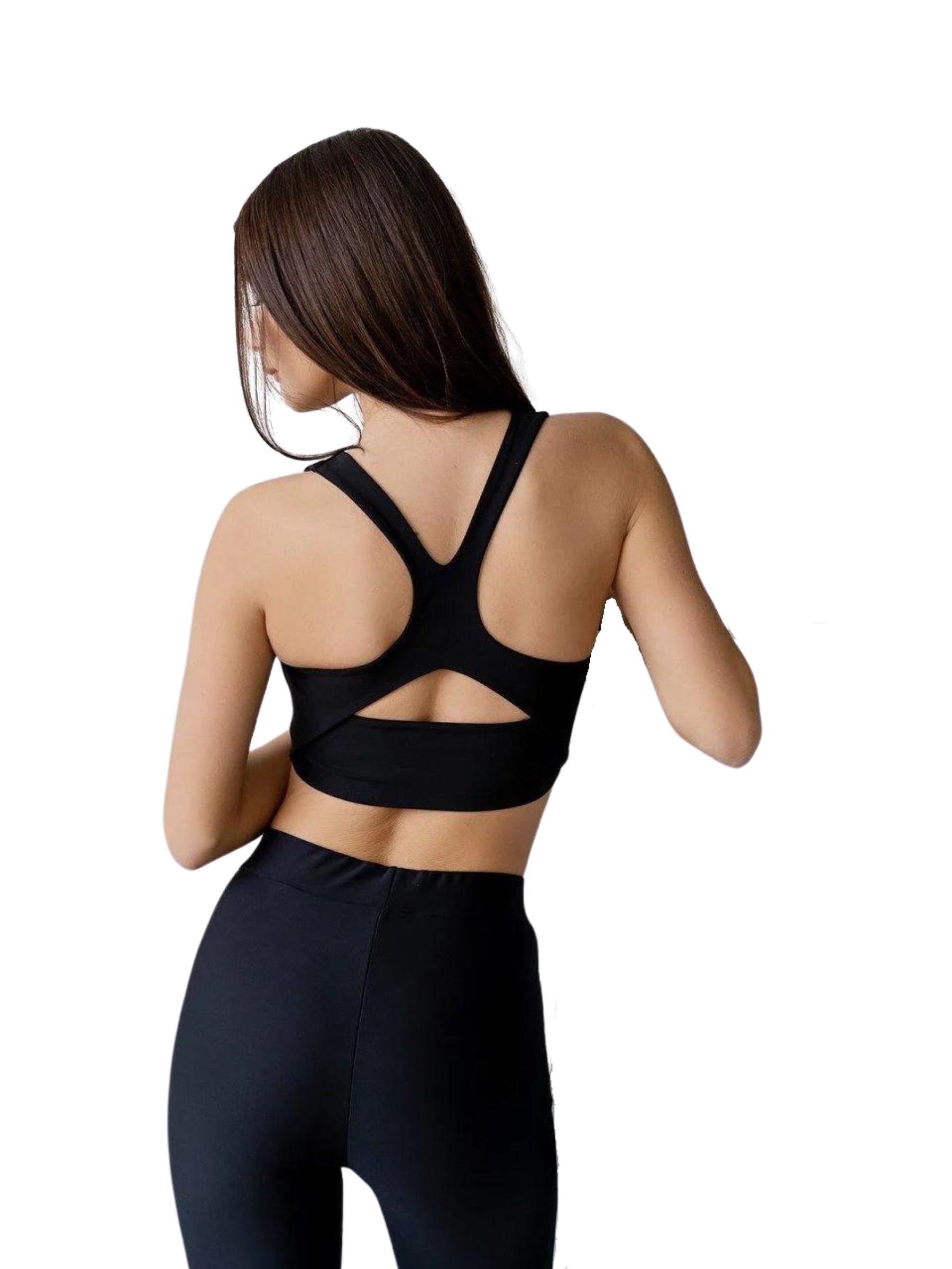 Frau in einem Lismina 237 Fit Sport-BH in Schwarz mit Racerback, mit abgewandtem Blick.